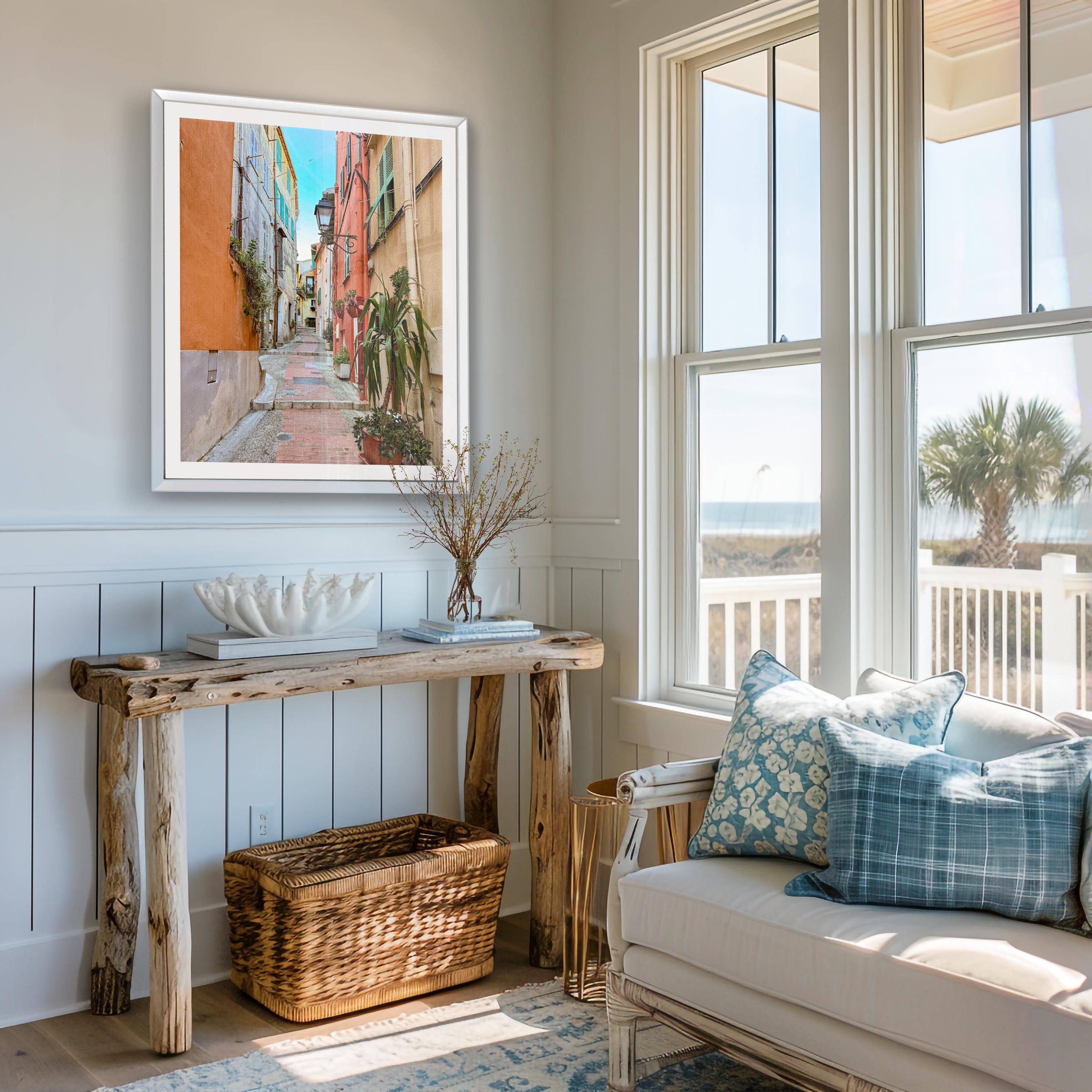 Living room with a wooden console table, sofa with pillows, and framed artwork on the wall.