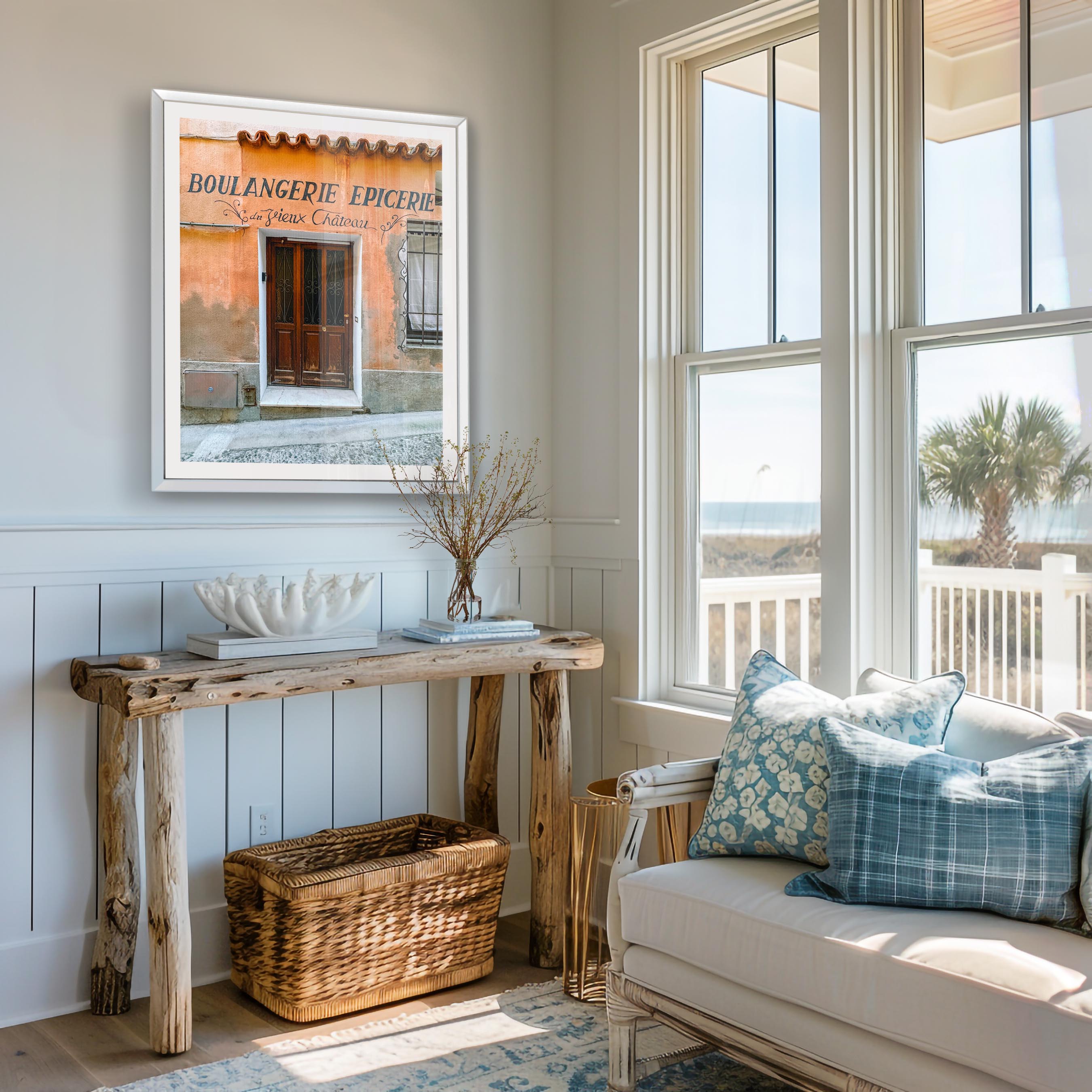 Cozy living room with a couch, wooden console table, and framed artwork.