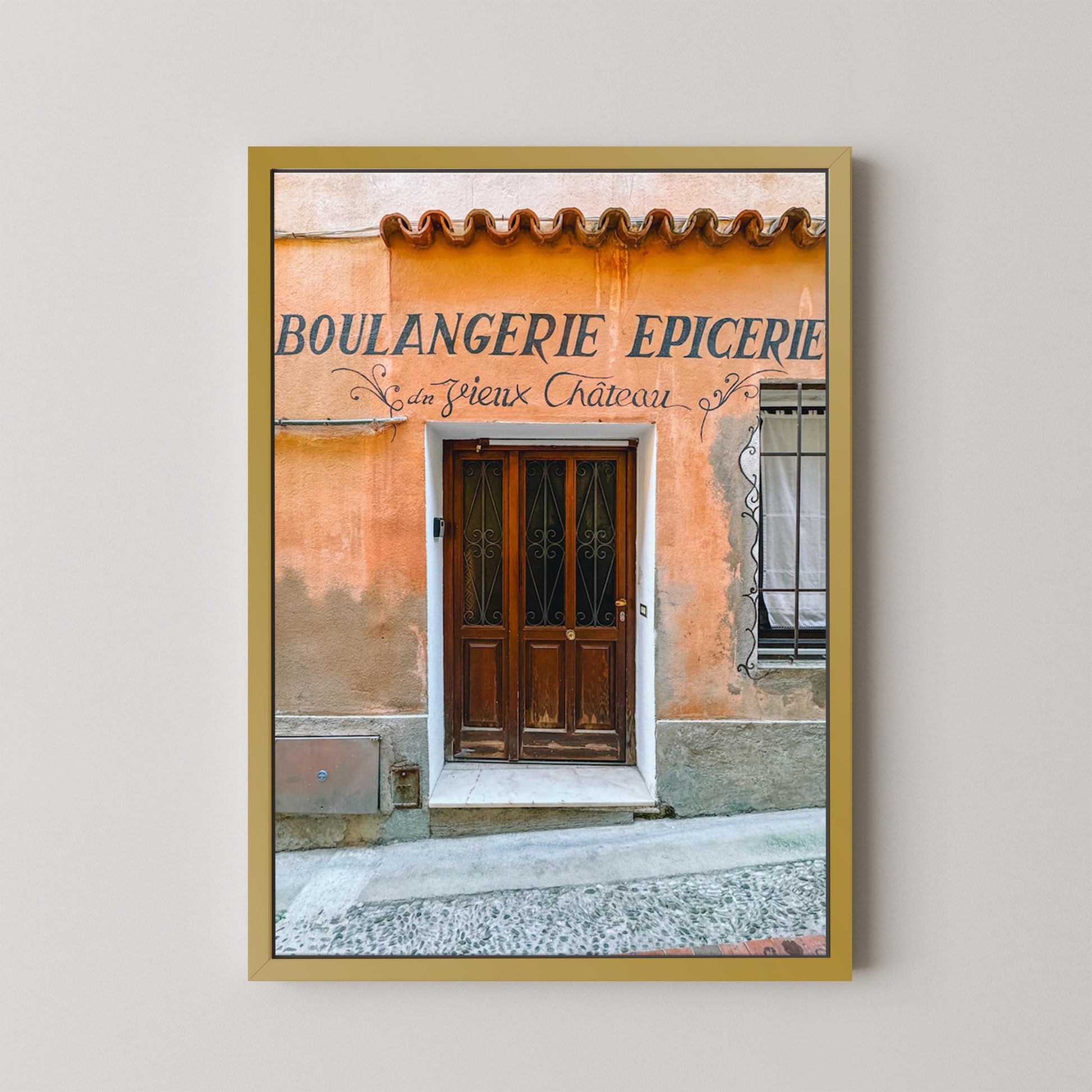 Framed photograph of a bakery door with 'Boulangerie Epicerie' sign on a light gray background